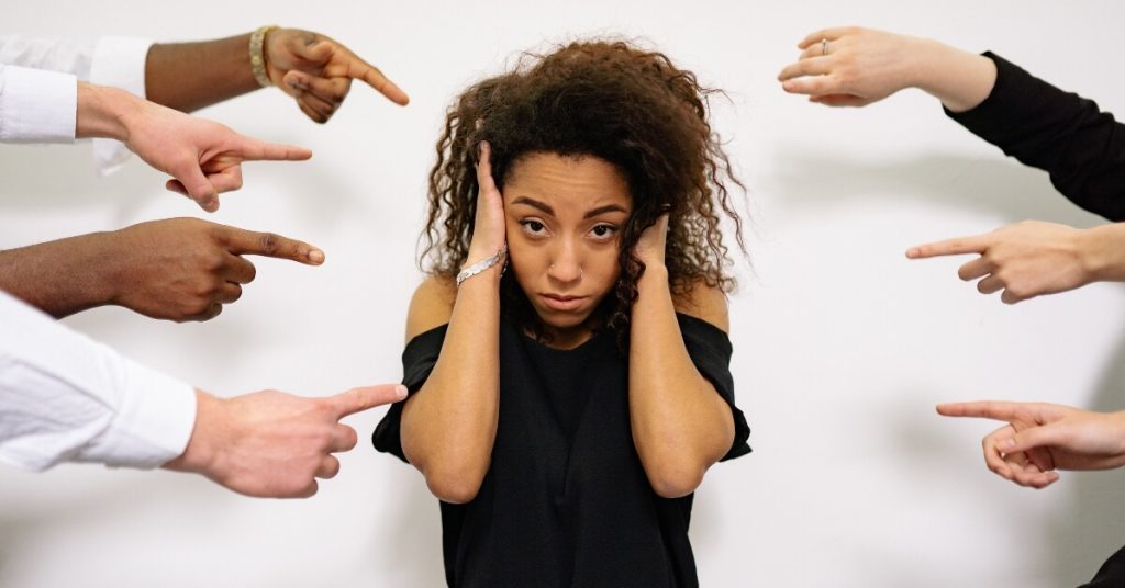 Employees pointing fingers after a mistake in a toxic blame culture